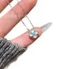 Atacado de fábrica de alta qualidade natural material perigoso natural jade água azul quatro- folha trevo pingente pequeno fresco s925 pingente de embutimento de prata