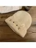 Venta al por mayor y dropshipping transfronterizo de gorros de punto de talla grande, con opciones de logotipo personalizado, que presentan lindos diseños de gatos y ofrecen protección a prueba de viento