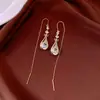 Pendientes de borla con flor de trébol de circonita vintage con un toque de alta gama, pendientes versátiles y de moda al por mayor