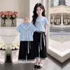 2026 Nuevo Elegante Moderno Delgado Manga Corta Top Niñas Cuadros Pantalones de Pierna Ancha Casual Conjunto de Dos Piezas Moderno