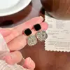 Elegantes aretes cuadrados morados para mujer, aretes de botón de nicho de lujo ligero, nuevo modelo popular 2026, aretes colgantes únicos y elegantes