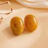 Pendientes de Botón Ovalados de Resina Transfronterizos Europeos y Americanos Pendientes Maillard de Otoño e Invierno Pendientes Simples de Moda Versátiles para Mujer Sensación de Alta Gama