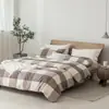Juego de cuatro piezas de algodón 100% teñido en hilo y lavado, algodón puro, sin marca, suministrado por el fabricante, funda de edredón de alta calidad, sábana bajera de estilo japonés, ropa de cama al por mayor