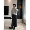 Falda de papel negra de otoño, falda de lana con caída, falda elástica casual de cintura alta con un ambiente relajado y elegante para mujer