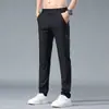 Pantalones Casuales de Seda de Hielo para Hombre Corte Delgado Elásticos 2026 Nuevos de Moda Otoño Secado Rápido Pantalones Deportivos para Hombre