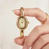 Relógio Pulseira GEDI Retrô Oval Dourado para Mulheres Números Romanos Mostrador Cravejado com Diamantes Leve Integrado Luxo de Nicho para o Dia a Dia Relógio de Quartzo