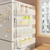 Estante lateral de almacenamiento para estante de refrigerador de cocina, soporte multifuncional de múltiples capas para condimentos y film transparente para uso doméstico montado en la pared
