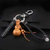 Doce Signos del Zodiaco Calabaza de Madera de Durazno con Llavero de Barra de Oro Hebilla de Cinturón de Cuero Colgante de la Suerte Zodiacal Regalo de Negocios