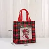 Bolsas de dulces navideños más vendidas transfronterizas, bolsas de embalaje navideño de tela no tejida a cuadros rojos, en stock, impermeables, bolsas de dulces de Halloween