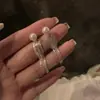 Brincos longos com franja de corrente de pérolas super fada femininos personalidade de nicho simples versátil brincos de temperamento joia de orelha com pino de prata