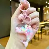 Nuevo llavero de muñeca de delfín con arena movediza relleno de aceite, colgante para mochila, decoración para bolso de pareja, regalo pequeño para venta al por mayor