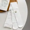 Leggings con forro de felpa para niñas, nuevo estilo otoño e invierno, felpa fina, engrosados, con lazo metálico y bordes festoneados, mallas de nueve puntos para niños