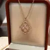 Collar Francés Antiguo de Alta Gama Versátil Rotatorio Doble Cara Trébol de Cuatro Hojas Concha Blanca Diseño de Lujo Ligero Cadena para Clavícula