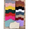 Suéter de punto con cuello semi-alto OEM para mujer, modelo otoño e invierno 2026, color albaricoque, top de manga larga, camiseta básica ajustada