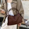 Bolsa de la suerte con cordón esmerilado para mujer 2026 nueva niche retro color sólido bolso de hombro bolsa de nube bolso cruzado de moda