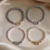 Pulsera de Perlas con Nariz de Cerdo de Circonita Estilo Retro Francés, Sensación de Lujo Ligero y Gama Alta, Joyería de Mano Moderna y Versátil para Mujeres