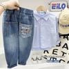 Jeans de dibujos animados con bolsillo trasero para primavera y otoño para niños 2025 Nuevos pantalones de mezclilla Jeans azules para niños Ropa para niños
