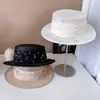 Chapéu de luxo leve, fio de cânhamo filipino, fita de pérola, chapéu plano feminino, primavera e verão, todos os tipos de proteção solar, chapéu de palha, moderno