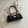 Bolso de Hombro Retro de Nicho Francés para Mujer 2026 Otoño Nuevo Bolso de Bowling Simple de Moda Portátil para el Viaje Diario