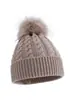 Novos estilos de outono e inverno de gorros infantis de tricô trançado, disponíveis na Amazon para vendas transfronteiriças, em cores sólidas com pompons, proporcionando calor e proteção contra o vento