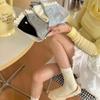 Calcetines de tubo medio de estilo coreano con diseño de orejas de madera y botones de amor de Songmu, de algodón peinado fresco.
