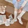 Calcetines a cuadros blancos y azules con lazo para mujer, primavera y otoño, cinco colores nuevos, calcetines de media pantorrilla, empalme dulce, calcetines holgados, calcetería Zhuji