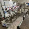 Máquina Pesadora Llenadora Automática de Fertilizante Líquido de 4 Cabezales con Equipo de Tapado Produce Máquina Llenadora Totalmente Automática de Anticongelante