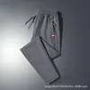 Pantalones casuales de otoño transfronterizos para hombre, corte holgado extragrande, estilo jogger versátil, cómodos para el trabajo y el deporte, pantalones largos