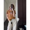 Linda y juvenil camiseta coreana de estilo holgado con bordado adelgazante, top casual de manga corta de dibujos animados para mujer, nuevo modelo de verano H072001