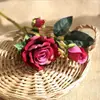 Al por mayor en stock 9 rosas de simulación ramo falso individual decoración de boda europea sala de estar flores de simulación de alta gama transfronterizas