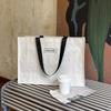 Tienda de Ropa de Alta Gama Bolsos Tejidos a Mano Ropa de Mujer Compras Embalaje con Bolsas de Embalaje Negras Gran Capacidad Venta al por Mayor