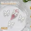 Nuevas joyas para uñas al por mayor lazo brillante hueco ojo de gato tridimensional combinan con todo para usar accesorios de decoración de uñas