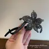 Pinza perezosa de flor de diamantes brillantes de alta gama vintage, flor de pedrería negra, accesorio para el cabello de moda de lujo ligero versátil para mujeres