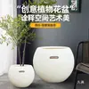 Maceta de plástico imitación piedra tamaño grande para el hogar estilo lujo ligero de alta gama color crema sala de estar oficina planta verde grande forma de bola redonda