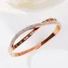 La moda coreana está llena de pulsera de cruz con números romanos de acero de titanio oro rosa pulsera femenina hipster