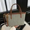 Bolso tipo cubo transfronterizo 2026 nuevo verano transpirable tejido a mano bolso de mano bolso cruzado color retro bloque de color estilo coreano bolso de mujer