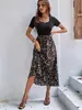 Vestido de Verano 2026 Nuevo Estilo Europeo y Americano con Estampado y Patchwork, Corte A para Mujer, Elegante y Adelgazante, Vestido Largo, Artículo Popular Transfronterizo