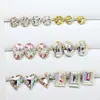 Dongzhou Rosa Sakura Recubierto Accesorios de Pedrería para Uñas Roca Dulce Corazón Retorcido Vidrio Puntiagudo Pedrería Brillante Adhesivo para Uñas Pedrería