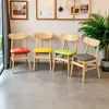 Sillas de comedor de madera maciza estilo nórdico con respaldo de mariposa, diseño simple y moderno, adecuadas para uso doméstico, restaurantes y entornos de comedor informal.; disponible para venta al por mayor