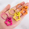 Llavero con Colgante de Campana de Estrella de Cinco Puntas de Colores Caramelo de Aleación Cubierta para Auriculares Decoración de Pareja