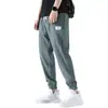 Calça Casual Masculina de Seda Gelada Nove Pontos Calças Masculinas Verão Fina Estilo Hong Kong Tendência Esportiva Perna Larga Respirável Calças de Verão