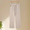 Novos estilos de outono e inverno para mulheres de meia-idade e idosas: calças forradas com fleece e cós elástico, calças cigarette estilo mom, padrão espinha de peixe, calças casuais cropped