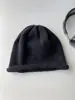 Gorro de lana color gris alpaca para mujer Otoño e Invierno Gorro de punto negro versátil que estiliza la cara gorro pequeño de punto para cabeza grande gorro para el frío