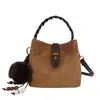 Bolso de mano nuevo de comercio exterior transfronterizo, bolso tipo cubo moderno y elegante para mujer, con un diseño único, adecuado para el trabajo diario, y se puede llevar como bolso de hombro o bolso cruzado