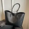La popular bolsa tote de gran capacidad para mujer de este año es la nueva bolsa casual simple para el hombro 2026, moderna y versátil para ir al trabajo.