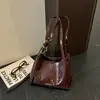 Bolso de axila de alta gama para mujer 2026 Nueva moda de otoño Bolso de hombro versátil Bolso de mano retro de lujo ligero para ir al trabajo