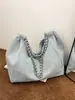 Bolso de mezclilla de gran capacidad para mujer, ligero, nuevo modelo verano 2024, bolso de hombro para estudiante universitario, bolso tote con cadena