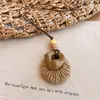 Nuevo collar colgante retro de ratán estilo chino para mujer, estilo bohemio, cadena de suéter de nicho de verano, accesorio de moda y versátil