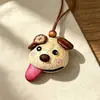 Encantador perrito peludo con la lengua fuera, llavero para bolso, colgante de dibujos animados natural, semillas de terapia de sonido curativas, popular en zonas escénicas, amuleto divertido y adorable