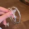 Brincos Europeus e Americanos de Círculo Grande Exagerado Design de Nicho para Mulheres Brincos de Diamante de Camada Dupla Estilo Ins Único Brincos Avançados